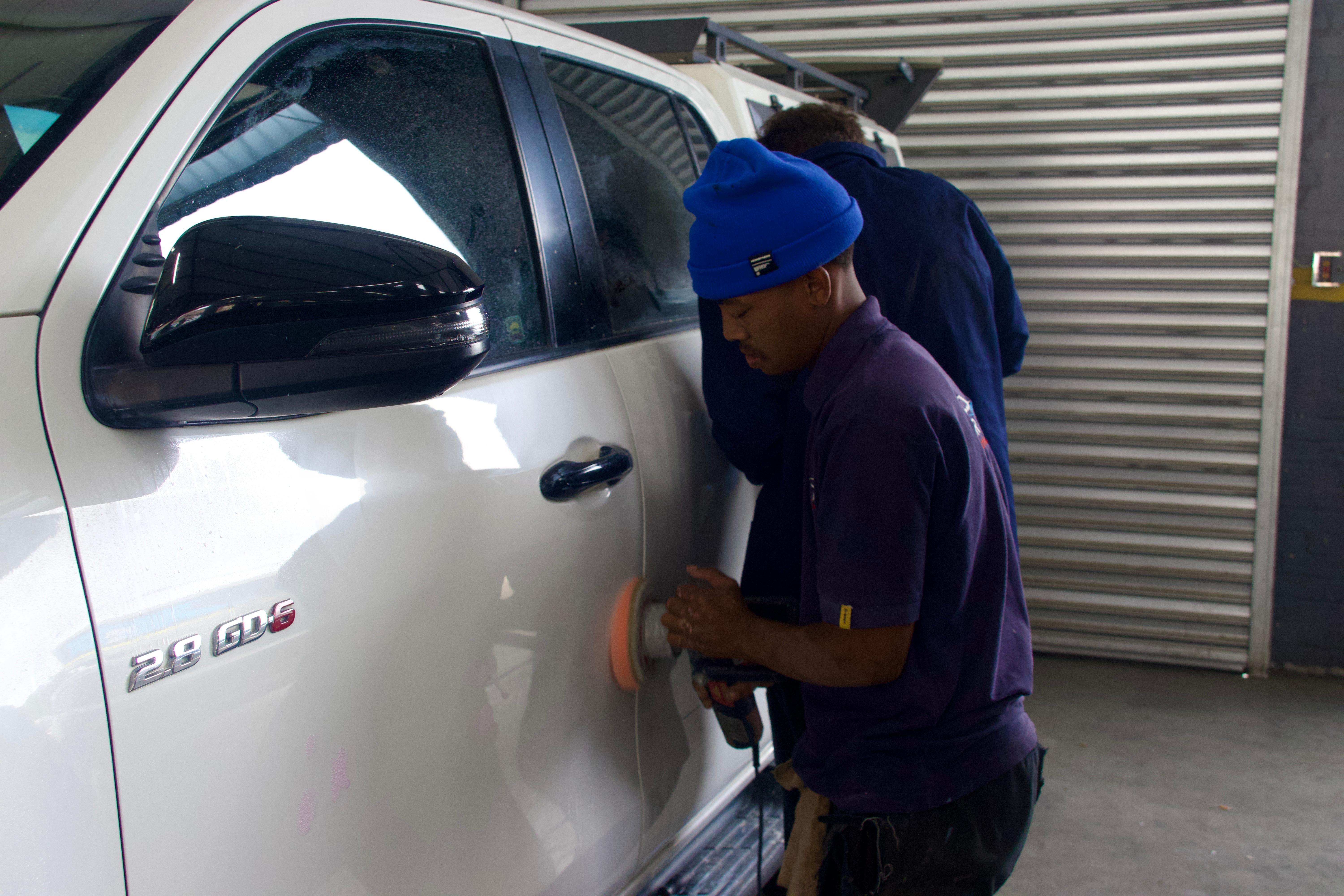 Machine polishing a vehicle at Ride Revive